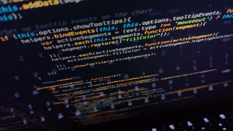 programmer looking at complex code - The Coding of What Looks Simple Is Often Highly Complex